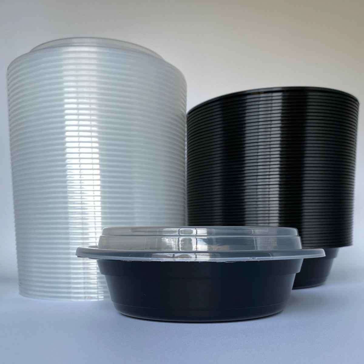 24 oz Black Round Containers with Clear Lids - 150/Case - Microwavable, BPA-Free, Food Storage & Takeout