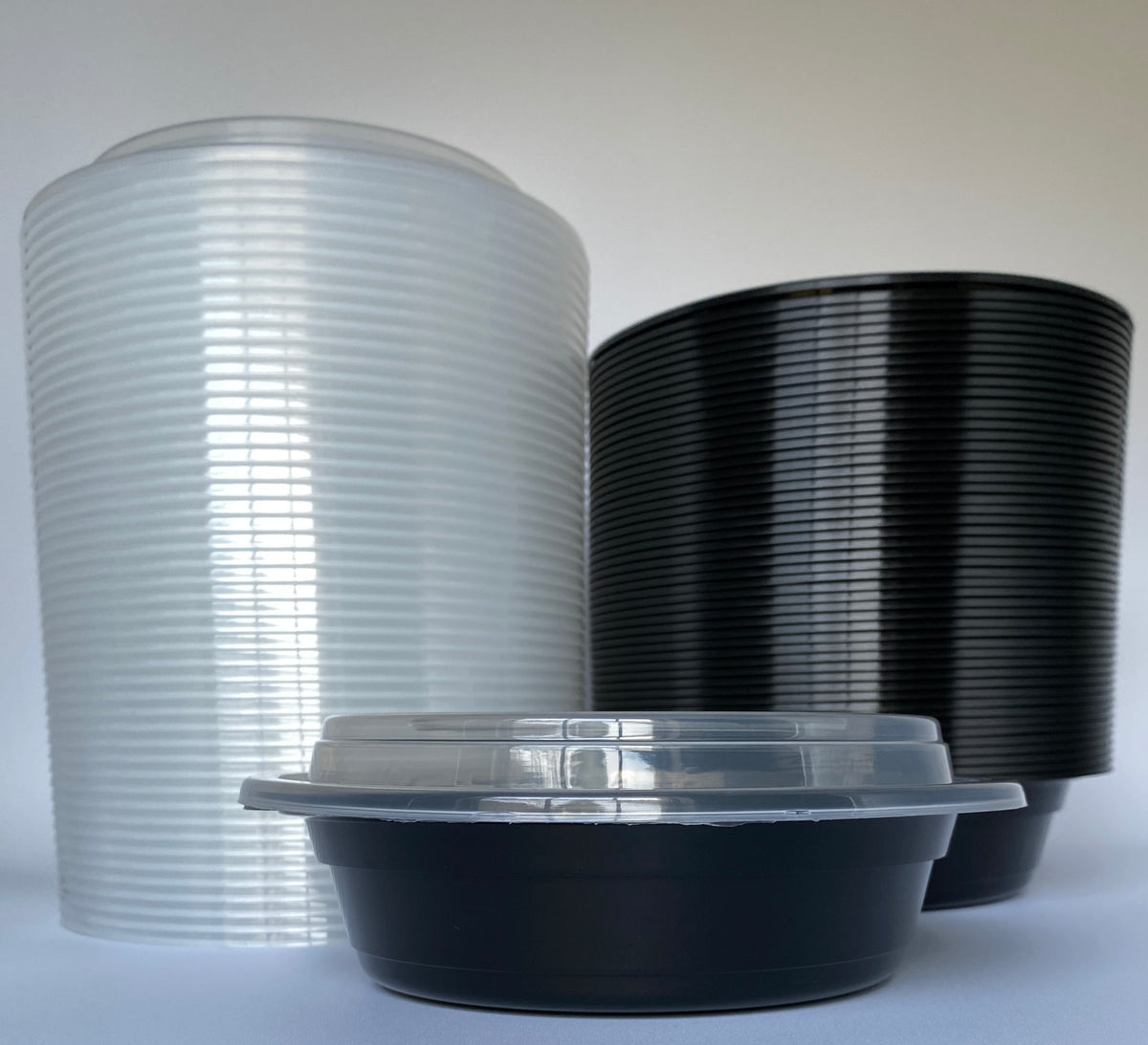 24 oz Black Round Containers with Clear Lids - 150/Case - Microwavable, BPA-Free, Food Storage & Takeout