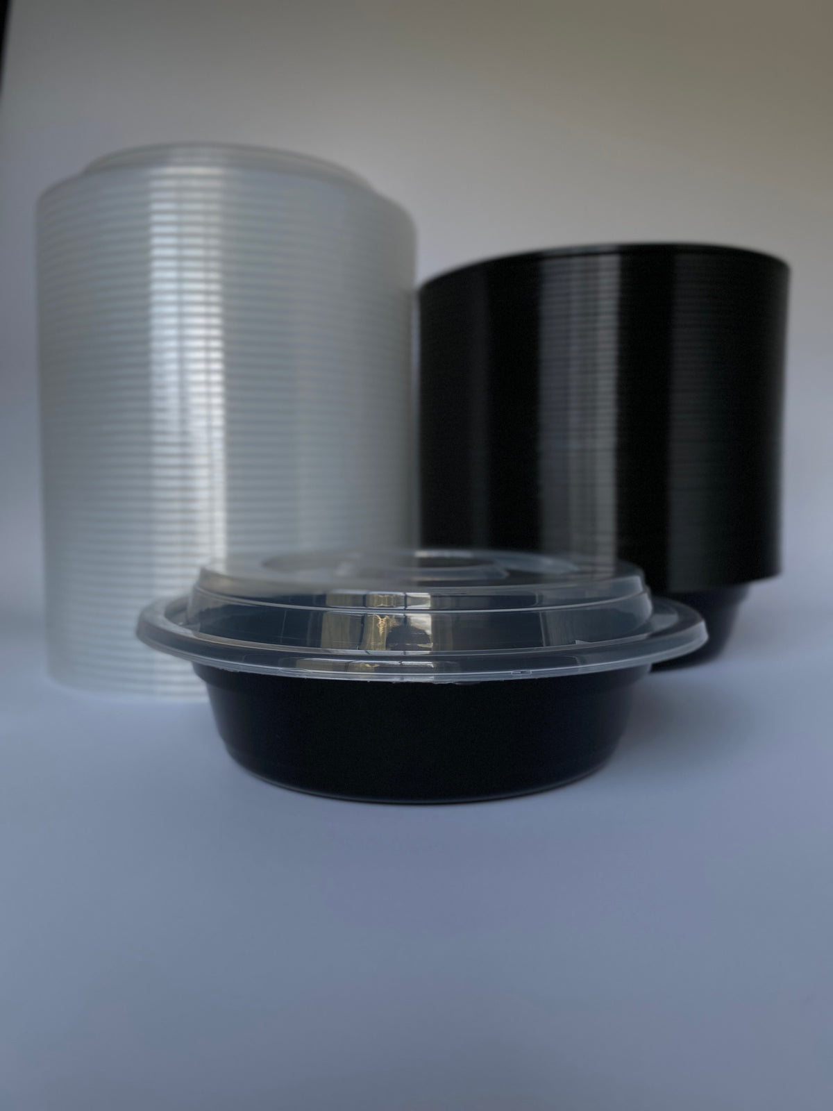 24 oz Black Round Containers with Clear Lids - 150/Case - Microwavable, BPA-Free, Food Storage & Takeout